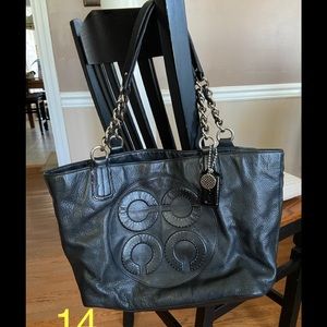 Black COACH tote style purse.